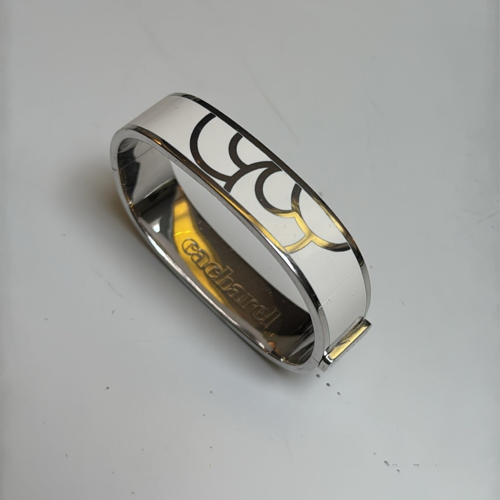 Cacharel White Enamel silver tone Bangle EUC slide lock up to open